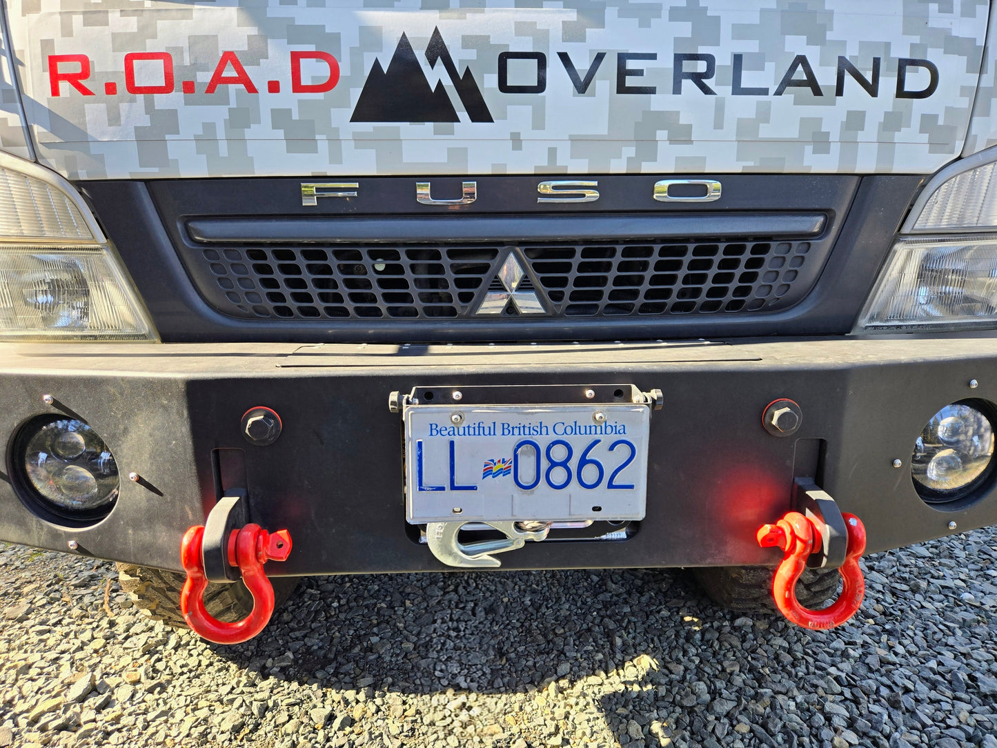 Flip-up license plate winch cover