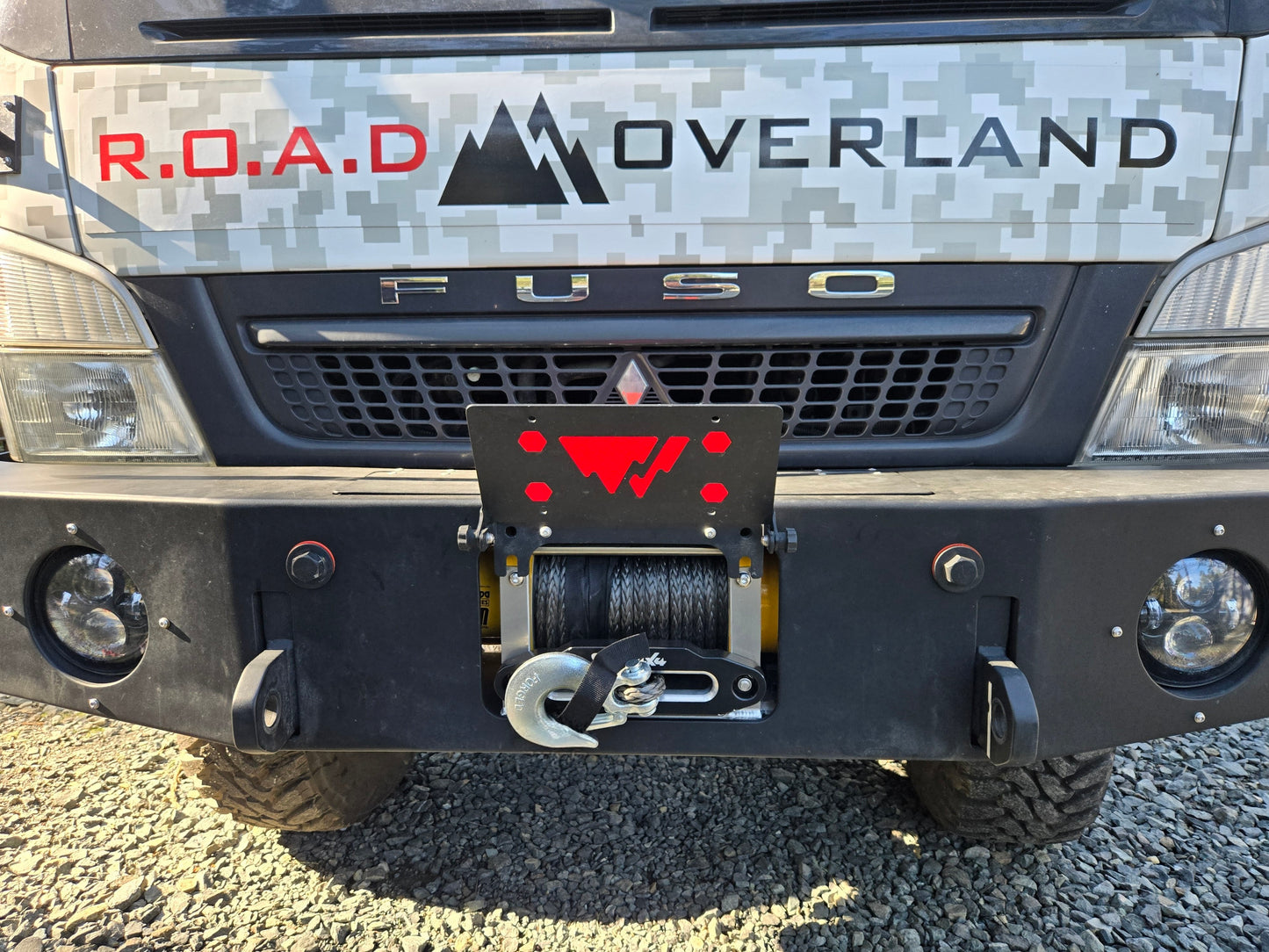 Flip-up license plate winch cover