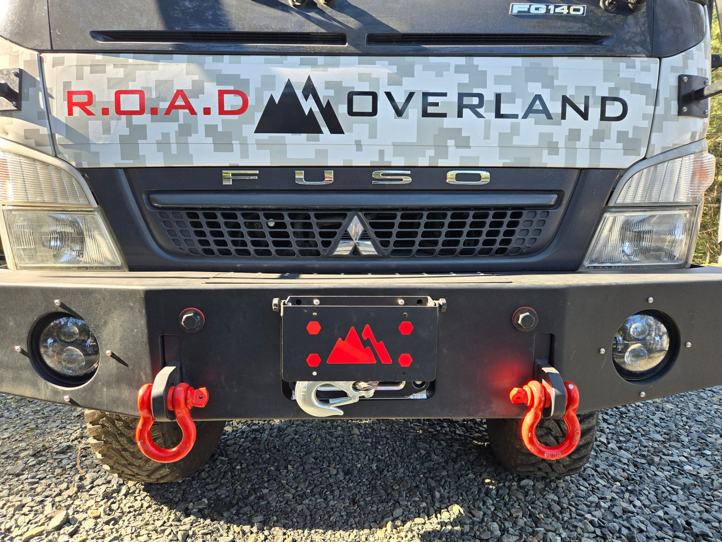 Flip-up license plate winch cover