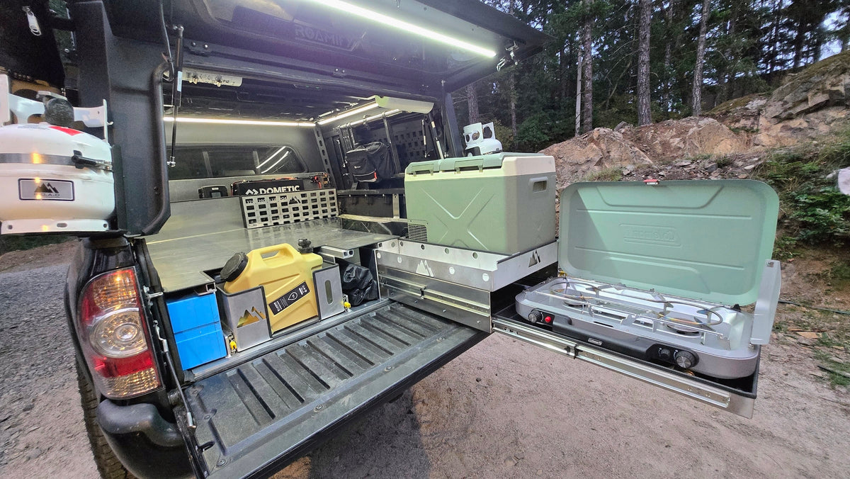Toyota Tacoma raised bed with pull out storage, fridge and stove trays
