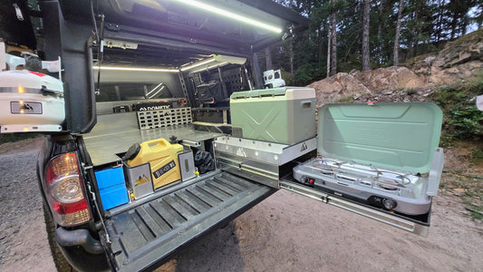 Toyota Tacoma raised bed with pull out storage, fridge and stove trays