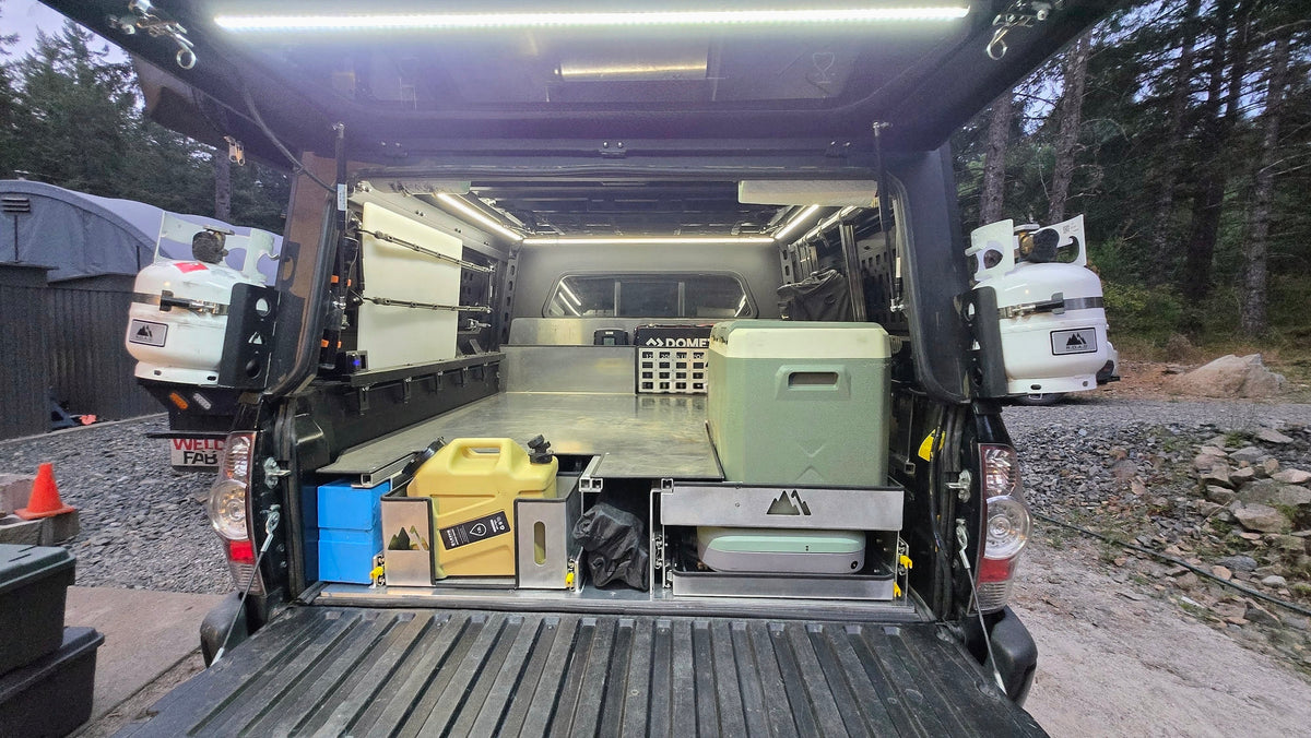 Toyota Tacoma raised bed with pull out storage, fridge and stove trays