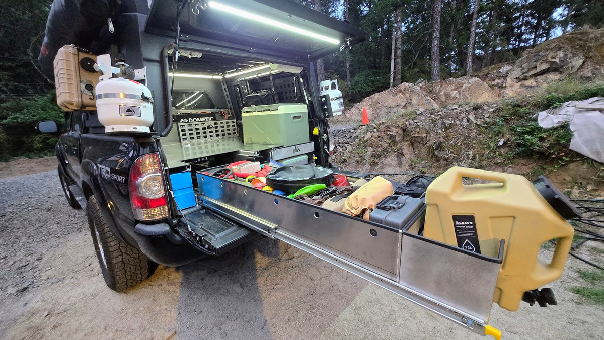 Toyota Tacoma raised bed with pull out storage, fridge and stove trays