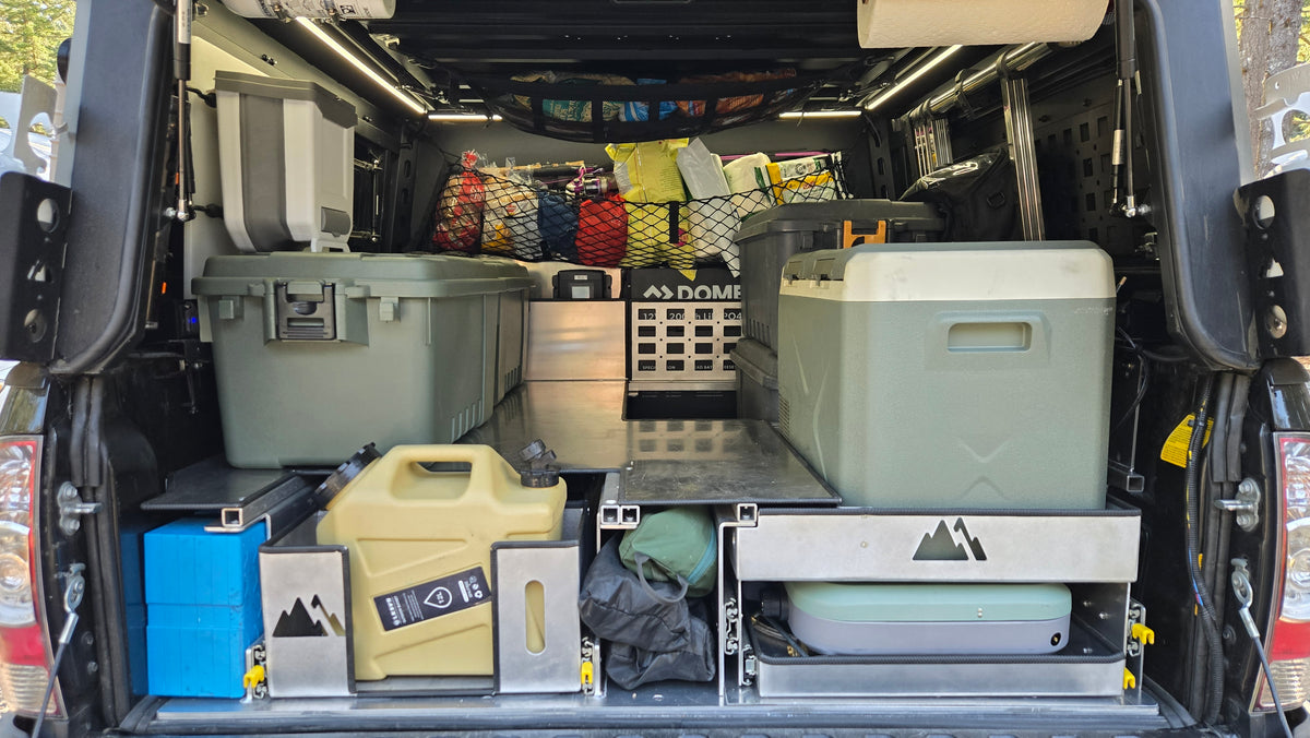 Toyota Tacoma raised bed with pull out storage, fridge and stove trays